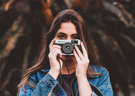 woman-holding-camera-1960183