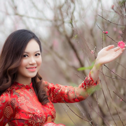 woman-wearing-red-long-sleeved-dress-holding-pink-petaled-807842